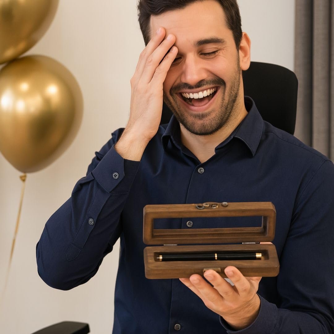Man holding the engraved pen set in its wooden box