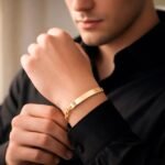 Man wearing the 18k gold plated Figaro bracelet