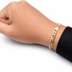 Figaro bracelet worn next to a watch